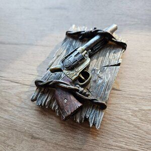 the old pistol paperweight